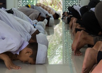 Group of Young Men Participating in Salat