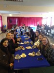 the teachers of escuela uruguay welcome St. Edward's students.