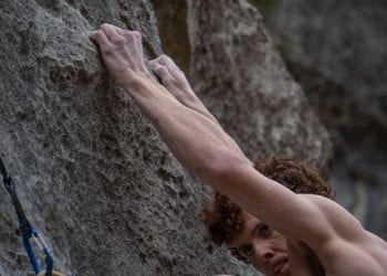 Climber grips holds as he plots next move at the Barton Creek G