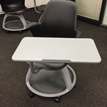 Chair with integrated desk on wheels