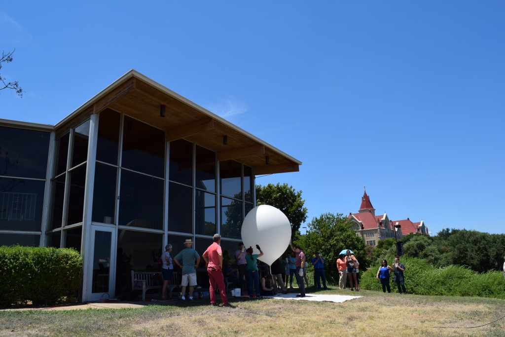 Weather balloon inflated with helium in front of the Mary Moody Northen Theatre at St. Edward's University prior to its release around 1:30 pm CDT on Thurs., 4 Aug. 2016.