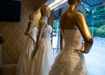 White wedding gowns in store window, Classic Studio, Nakhon Si Thammarat City
